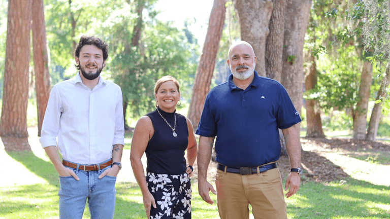 "Team at Frederica Wealth Advisory, embodying a family-oriented, personalized approach to wealth management in a tranquil outdoor setting."