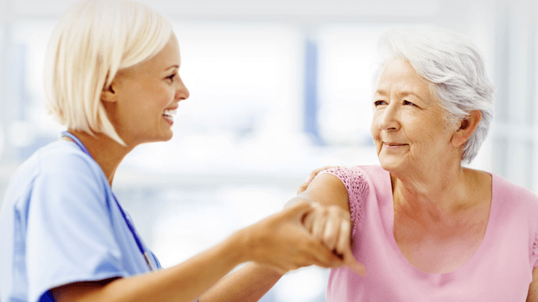 ChatGPT said: "Dr. Spyridon Chakalos, a chiropractor, smiling with a patient, representing his compassionate, holistic approach to healing and care."