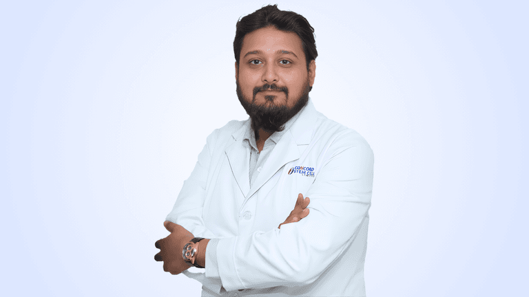 Dr. Monzur A Khoda, interventional rheumatologist and stem cell specialist, standing confidently in a white lab coat.