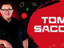 Tom Sacco pictured beside his name against a red and black Happy Joe’s themed background.