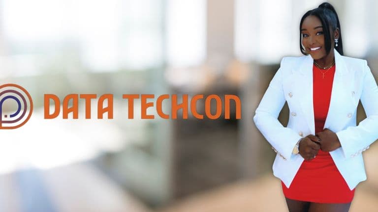 Tobe Awosanya, Founder & CEO of Data Techcon, wearing a white blazer and red dress, smiling confidently.