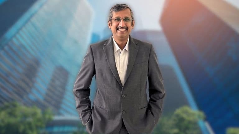 Sagar Surana, an experienced financial leader, stands confidently in a professional setting, embodying expertise in global finance