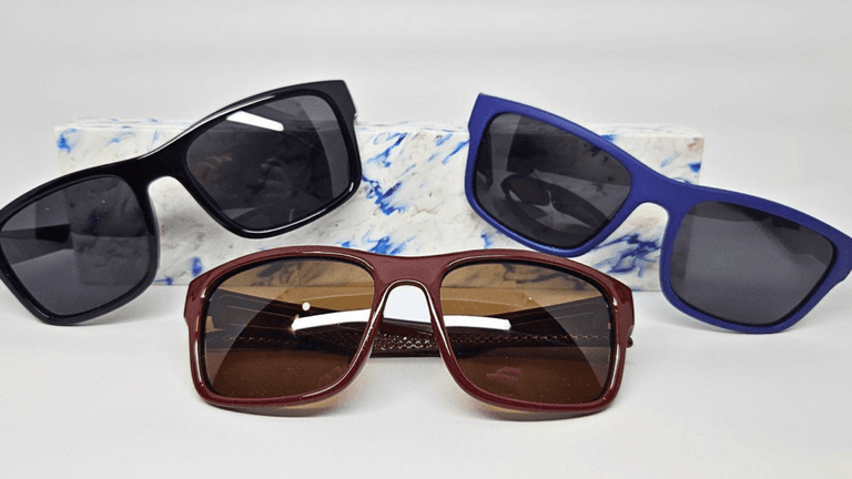 The image features three pairs of stylish sunglasses, showcasing durability and design innovation inspired by Regenesis' sustainable materials.