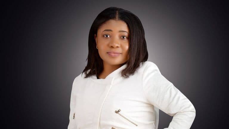 Joy Chukwu, Co-Founder & CTO of Ovaboss, poses in a white jacket, symbolizing innovation and leadership in e-commerce.