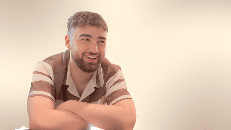 Joseph Stephanides smiling, reflecting on his journey from struggles to building Monopoly Markets.