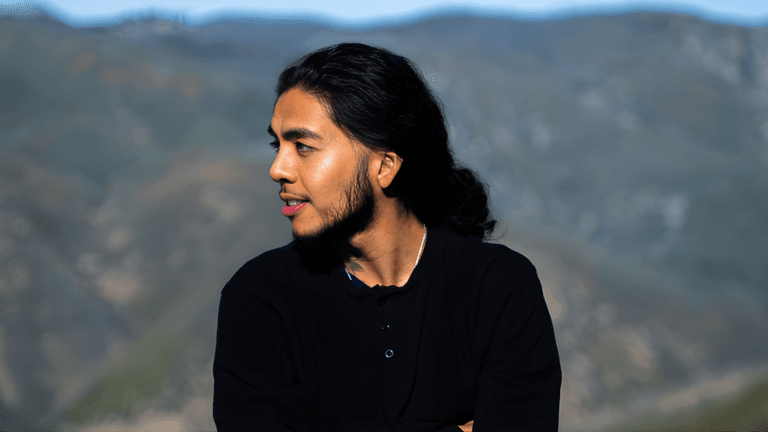 Almachize reflecting in nature, embracing his journey toward personal freedom and sovereignty.