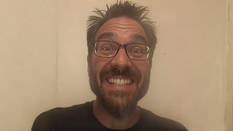 Greg 'Mad Scientist 5150' Nikolettos smiling, showcasing his passionate commitment to revolutionizing supplementation with liposomal technology.