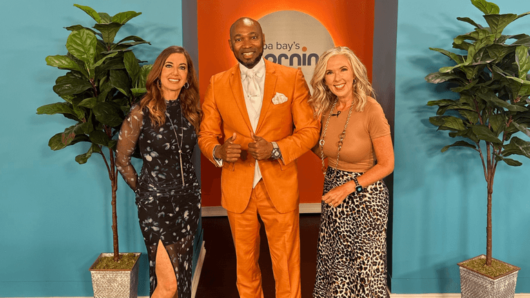Rick E. Cutts posing with two television hosts on the Tampa Bay's Morning Blend set.