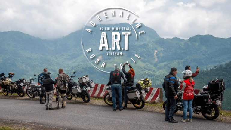 Riders stopping for a break along Vietnam’s Ho Chi Minh Trail with breathtaking mountain views.