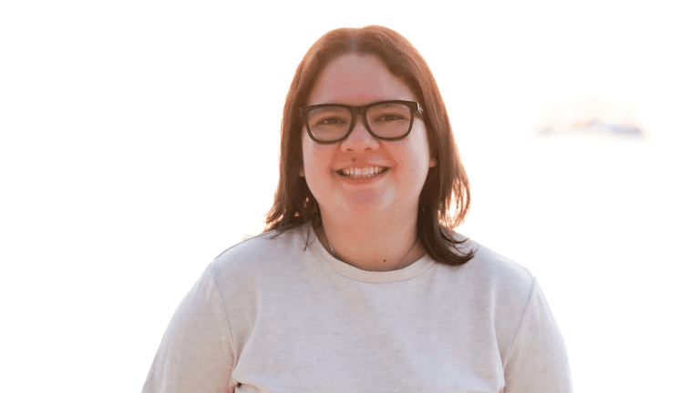Krystal Blackwell, founder of Krystal Designs Marketing, smiling confidently, represents her agency's innovative EnquiryOS™ system for law firm marketing.