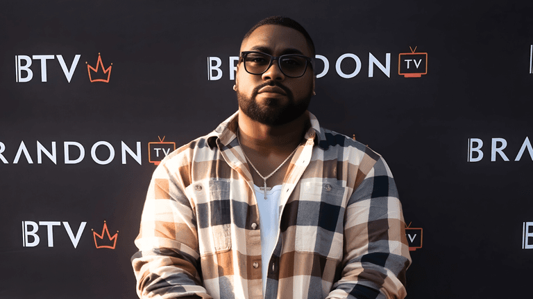 Luciano Layne, Grammy-nominated songwriter and new A&R at Virgin Music Group, poses at a BTV event, showcasing leadership.