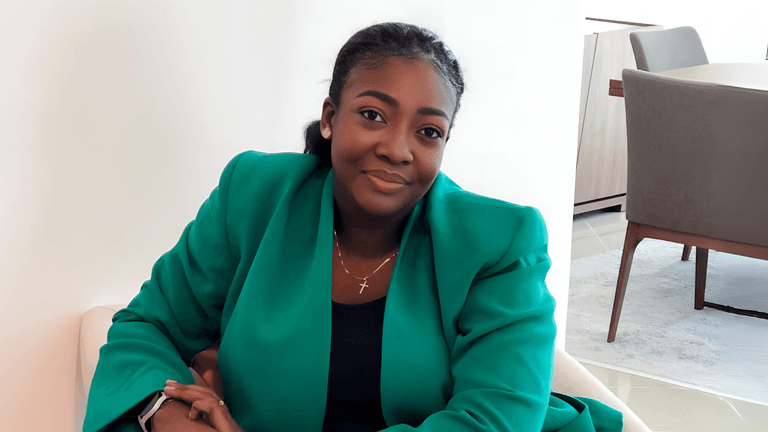 Dr. Osigbodi Ajose, CEO of Levitikal Consulting, smiles confidently in a professional setting, embodying her role as a visionary leader empowering young women to take on leadership positions and drive societal change.