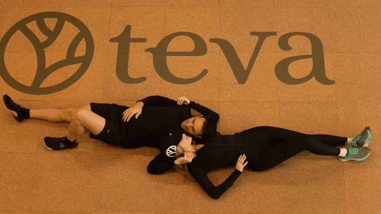 Founders relaxing beneath Teva Wellness logo inside Polanco luxury fitness club, representing integrated training, recovery, community and lifestyle performance hub.