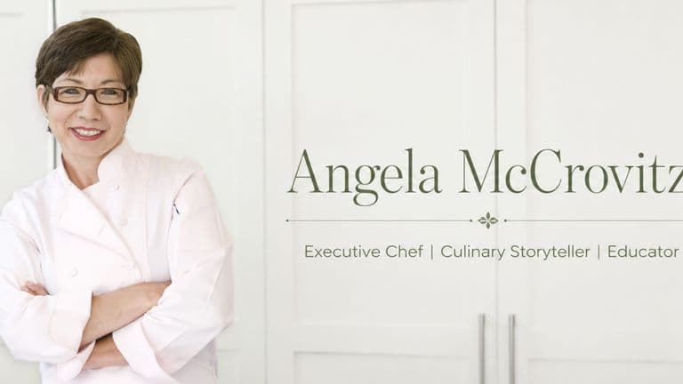 Angela McCrovitz in a chef's coat beside text identifying her as an executive chef, culinary storyteller, and educator.
