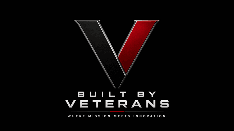 Built By Veterans logo with stylized red and black V and mission statement on black background.