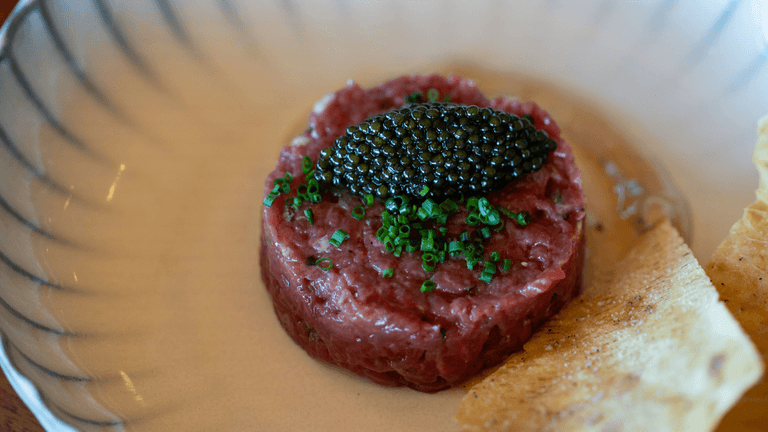 "Manzo Fassone beef tartare with caviar, showcasing the brand’s premium, raw, and delicately handled beef for luxury dining."