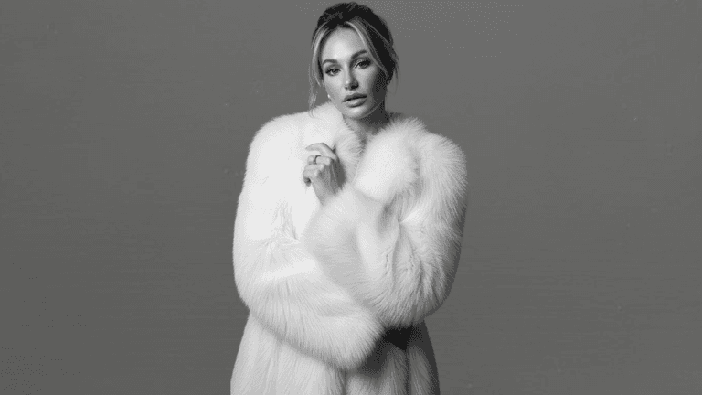 "Natacha Christeler, Master Injector and industry leader, posing elegantly in a chic black suit, embodying precision and artistry in aesthetic medicine."