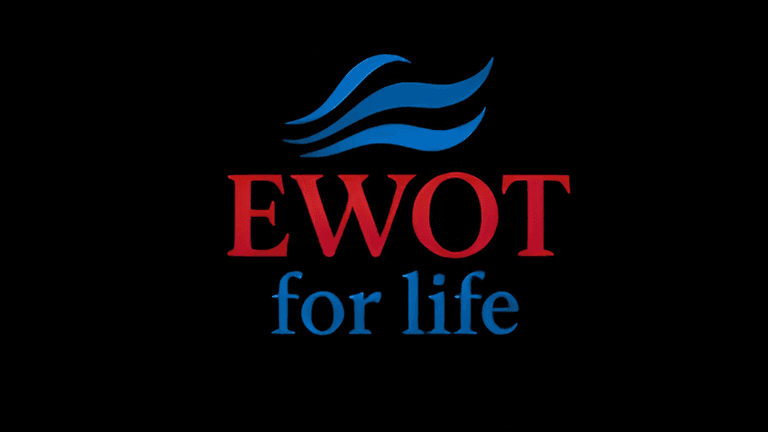 The logo of EWOT for Life, featuring the bold red and blue text 'EWOT' with the tagline 'for life' in blue. The design includes flowing wave-like elements in blue, symbolizing the breath-enhancing technology associated with the brand.