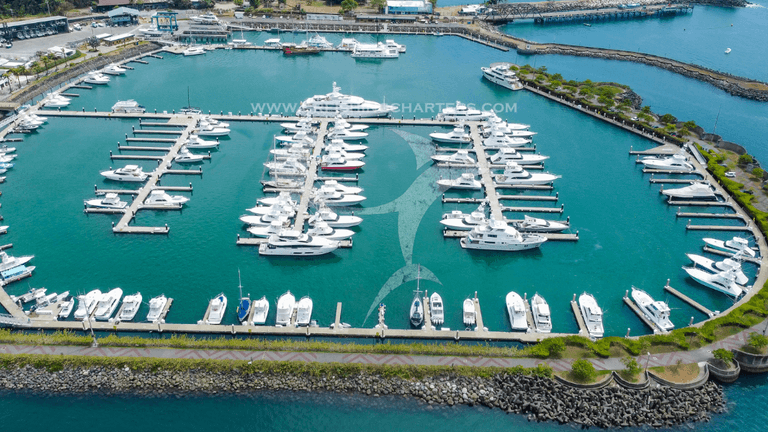 Aerial view of a marina filled with luxury yachts in Costa Rica.