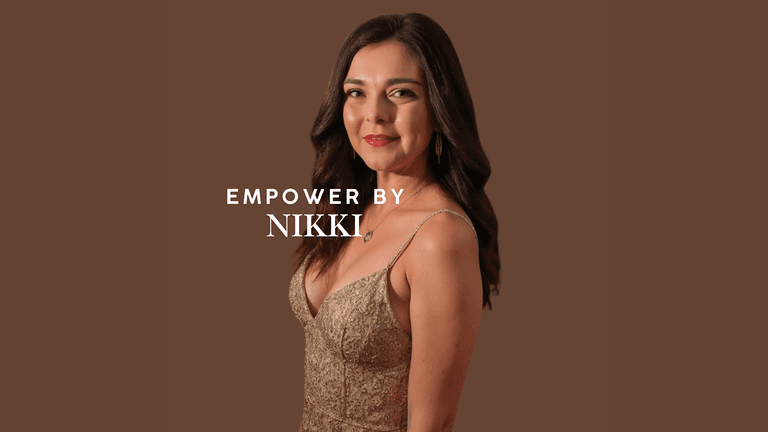 A woman in a gold dress stands confidently, smiling with a warm expression. The text 'EMPOWER BY NIKKI' is displayed above her name, Nikki, symbolizing empowerment and resilience. The background is a simple brown shade, highlighting her elegance and strength.