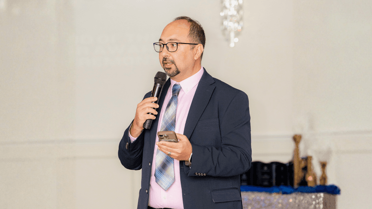 "Zaid AlChalabi, COO of Far Out Solutions, speaking at an event, leading global technology transformation in property management."
