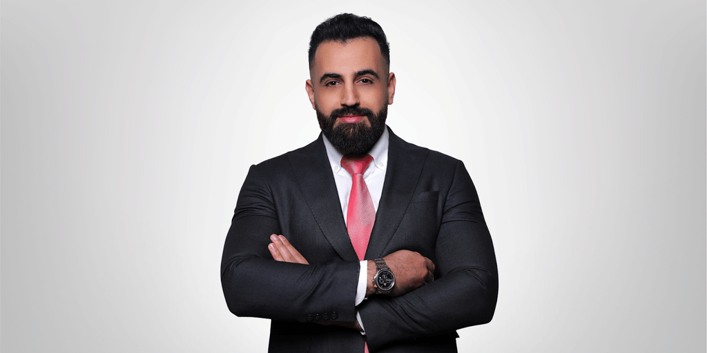 "Bashar Amin, founder of Gradezilla, stands confidently in a business suit, embodying leadership and expertise in digital marketing education."