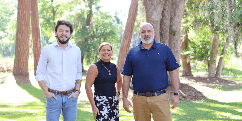 "Team at Frederica Wealth Advisory, embodying a family-oriented, personalized approach to wealth management in a tranquil outdoor setting."