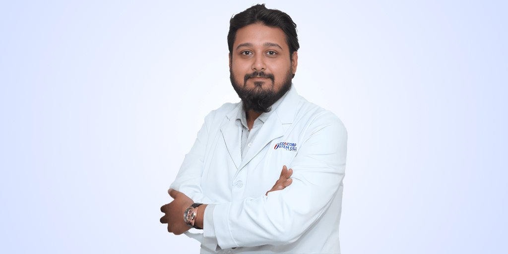Dr. Monzur A Khoda, interventional rheumatologist and stem cell specialist, standing confidently in a white lab coat.
