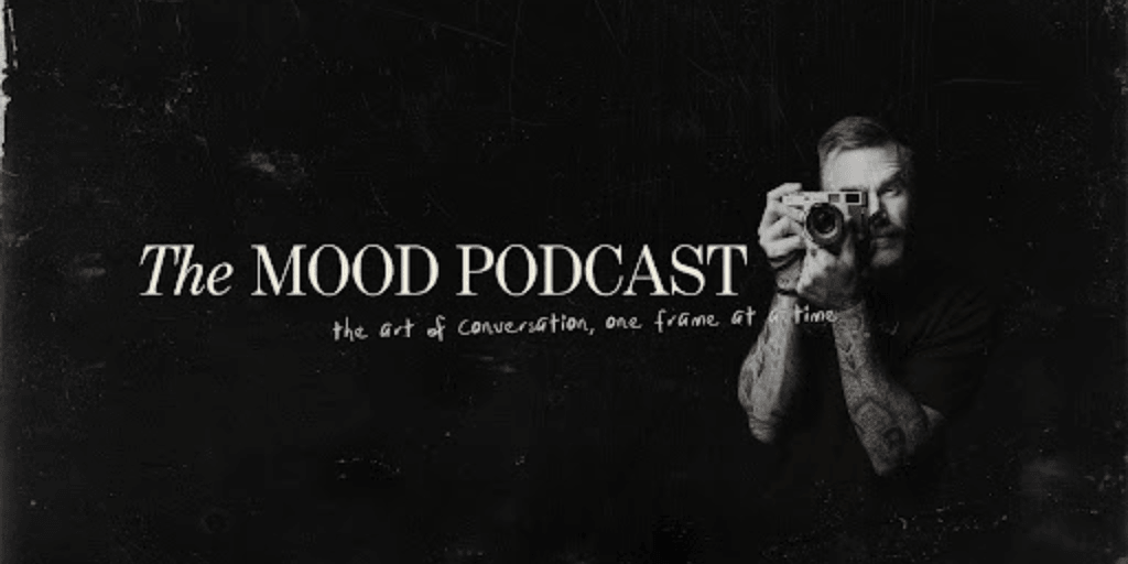 "The MOOD Podcast logo with a photographer holding a camera, focusing on authentic storytelling."