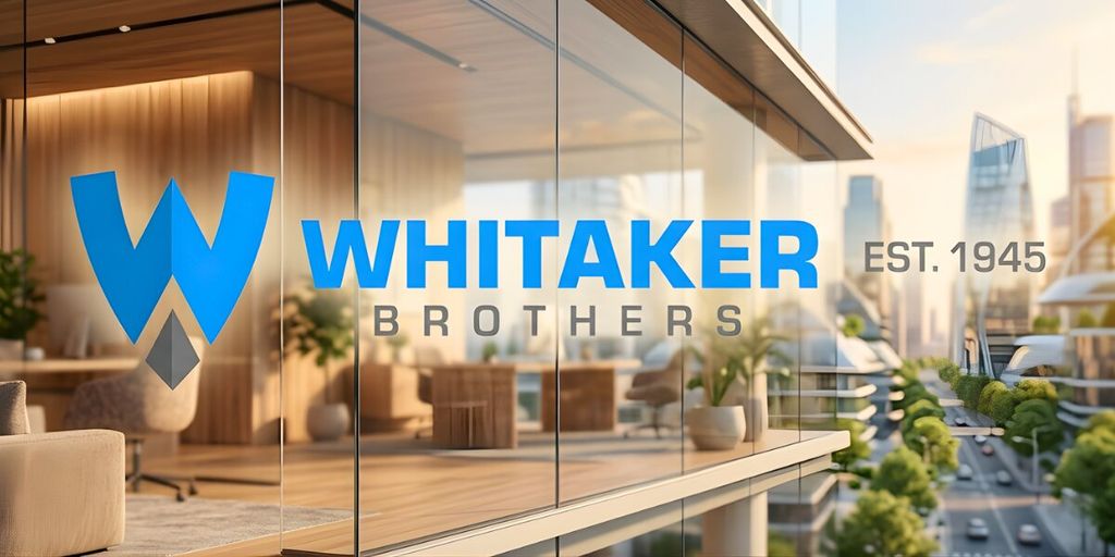 A modern office building with a glass façade displays the "Whitaker Brothers" logo in blue. The background shows a cityscape with greenery, suggesting innovation and growth.