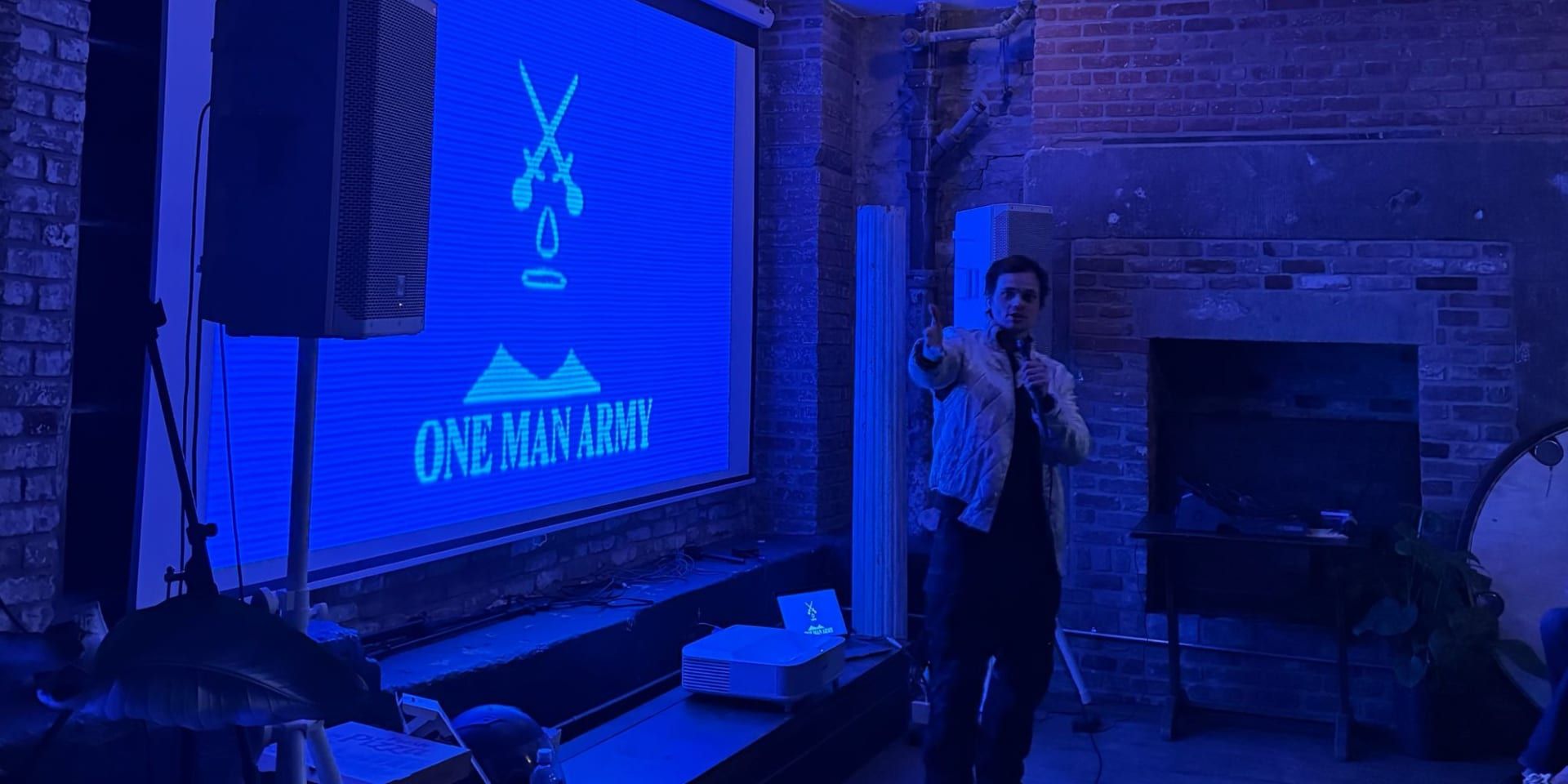 **Aaron Dalla Villa presenting One Man Army’s studio vision at a live screening and industry event.**
