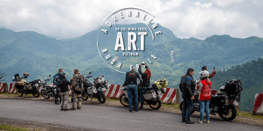 Riders stopping for a break along Vietnam’s Ho Chi Minh Trail with breathtaking mountain views.
