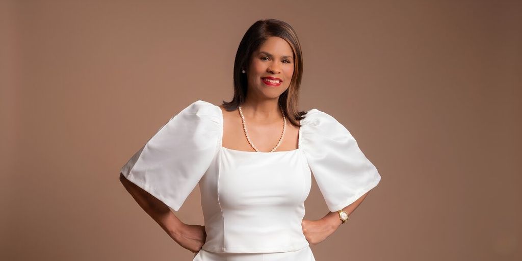 CeWyon Chandler-Ward posing in white outfit against neutral background promoting entrepreneurship, publishing, and women’s leadership.