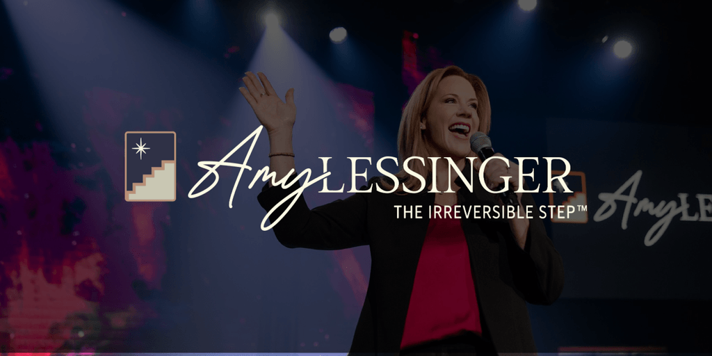 Amy Lessinger speaking at an event, representing "The Irreversible Step™" leadership transformation framework, empowering leaders to evolve.