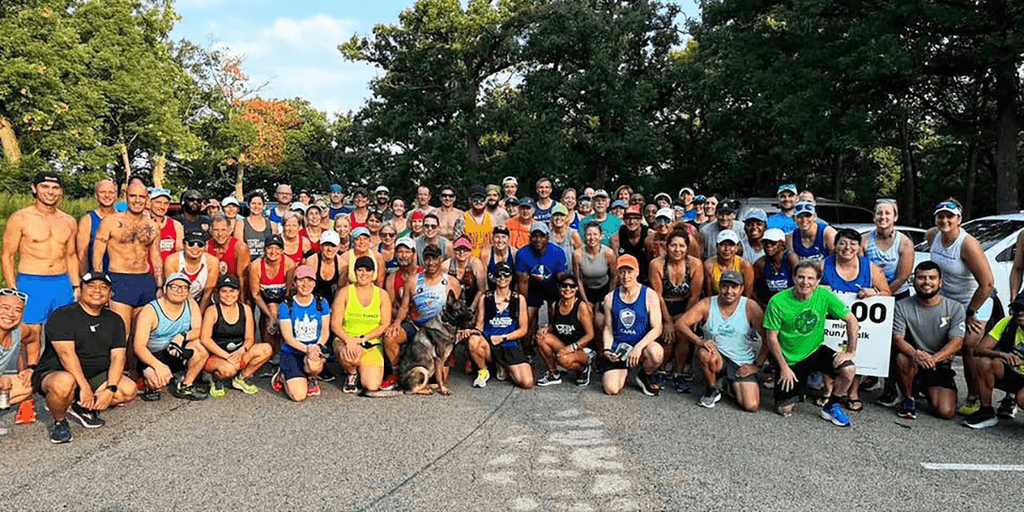A diverse group of runners from the Refresh Run Club in Madrid, united by wellness, performance, and community spirit.