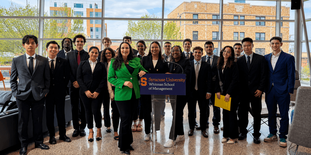 Marie Adornato speaking with Syracuse University Whitman School of Management students at a campus event.
