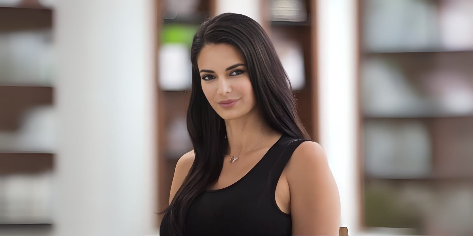 Setareh Motamedi wearing a black sleeveless top in a professional indoor portrait
