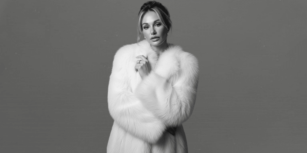 "Natacha Christeler, Master Injector and industry leader, posing elegantly in a chic black suit, embodying precision and artistry in aesthetic medicine."