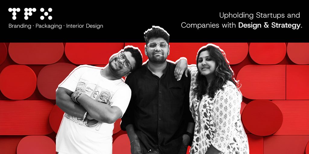 Three designers from The Factor X pose confidently against a bold red background promoting branding and strategy.