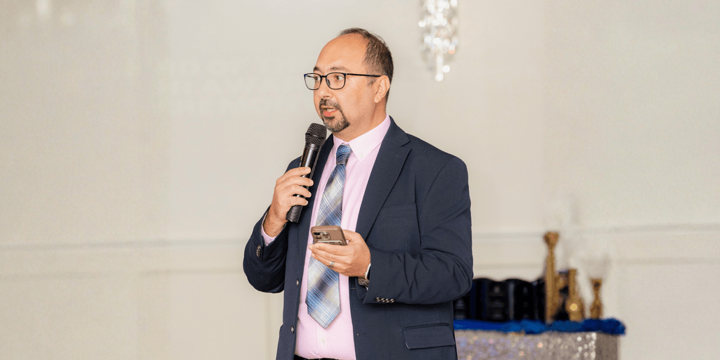 "Zaid AlChalabi, COO of Far Out Solutions, speaking at an event, leading global technology transformation in property management."