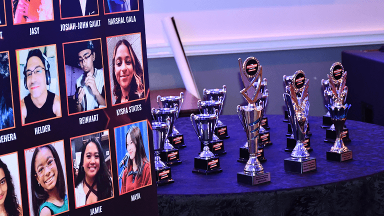 "Stage Bloom's event showcasing diverse performers with awards and recognition, highlighting the company's commitment to artist development and community impact."