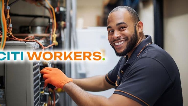 Smiling technician working on an air conditioning unit, wearing an orange glove, with the Citi Workers logo in the foreground, showcasing skilled tradespeople at work.