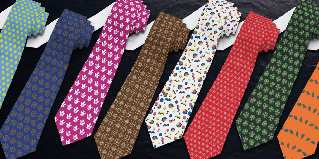 Colorful patterned ties arranged in a row on a dark background