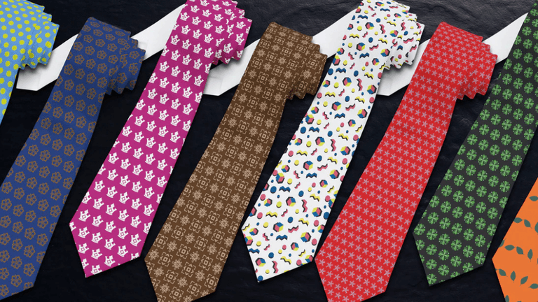 Colorful patterned ties arranged in a row on a dark background