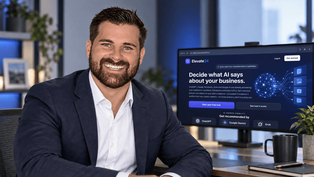 Smiling man in a suit poses in an office with a computer screen displaying AI software