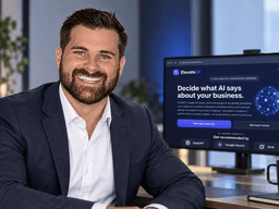 Smiling man in a suit poses in an office with a computer screen displaying AI software