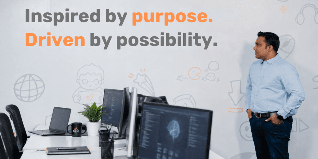 A man stands in an office, reflecting on a motivational poster about purpose and possibility