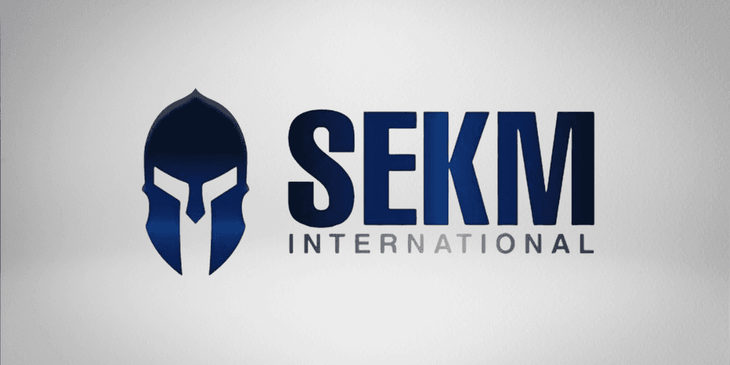 Logo of SEKM International featuring a stylized spartan helmet and bold typography