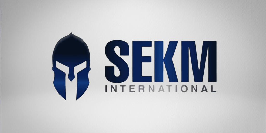 Logo of SEKM International featuring a stylized spartan helmet and bold typography