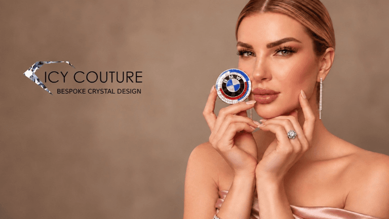 A woman holds a colorful crystal design, showcasing elegant jewelry against a neutral background